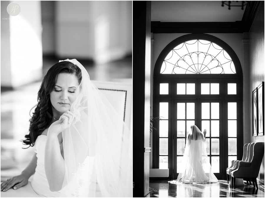 black and white bride in front of large window at the berkeley oceanfront hotel in asbury park wedding