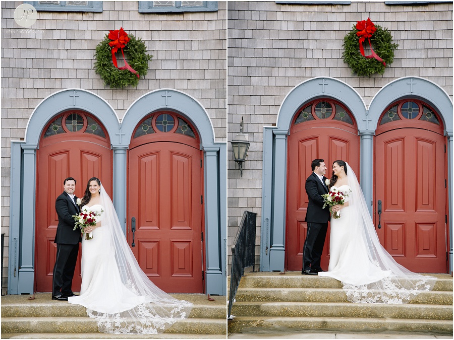 bride and groom in front of church with big red doors and wreath in asbury park new jersey