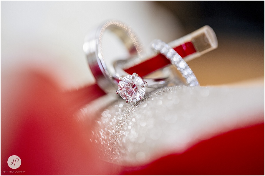 engagement diamond ring on heel of louboutin shoe with red bottom