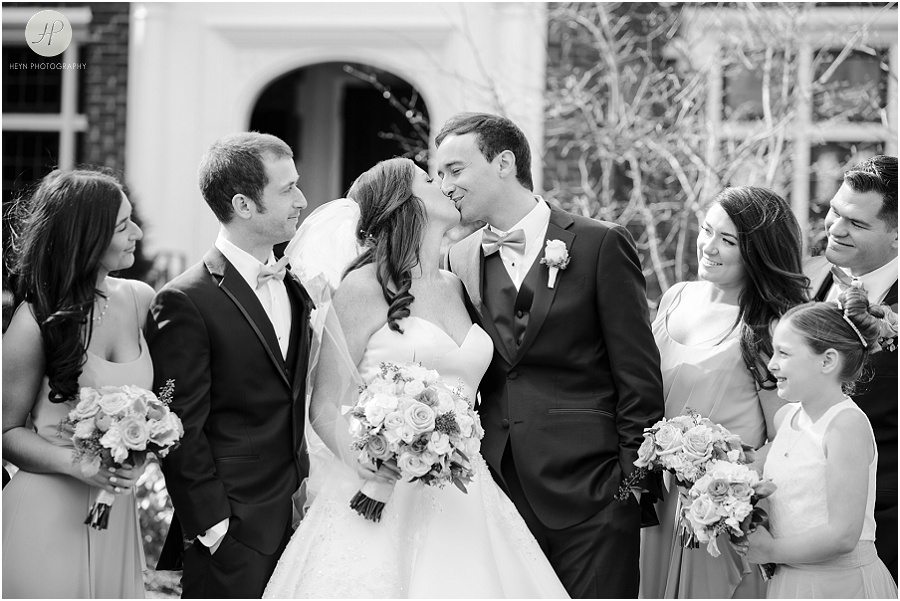 bride and groom kiss in spring lake new jersey wedding