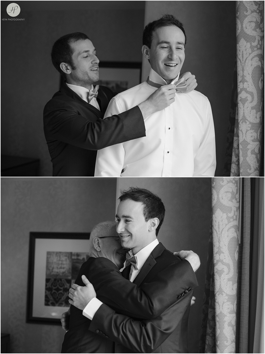 black and white groom gets ready for his clarks landing yacht club wedding