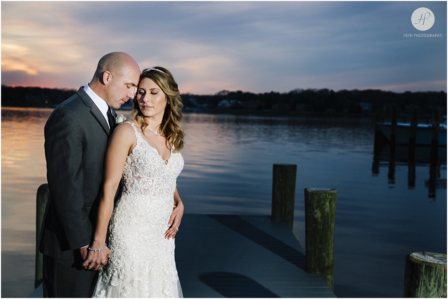 romantic bride and groom at sunset at clarks landing yacht club wedding in point pleasant nj