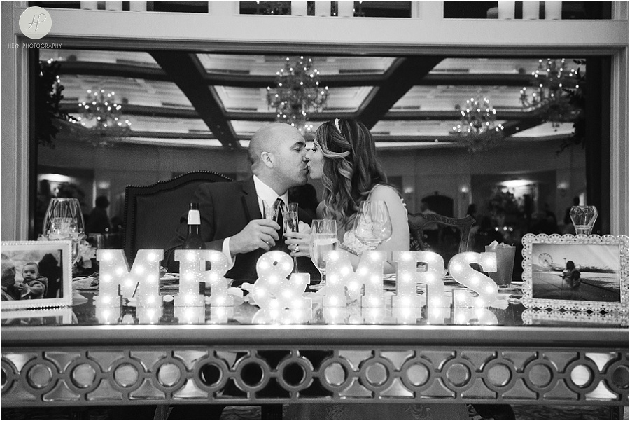 bride and groom kissing at wedding reception at clarks landing yacht club in point pleasant nj