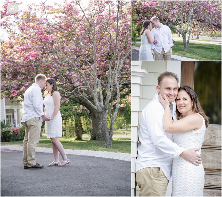 Couple by cherry blossom in Spring Lake engagement session