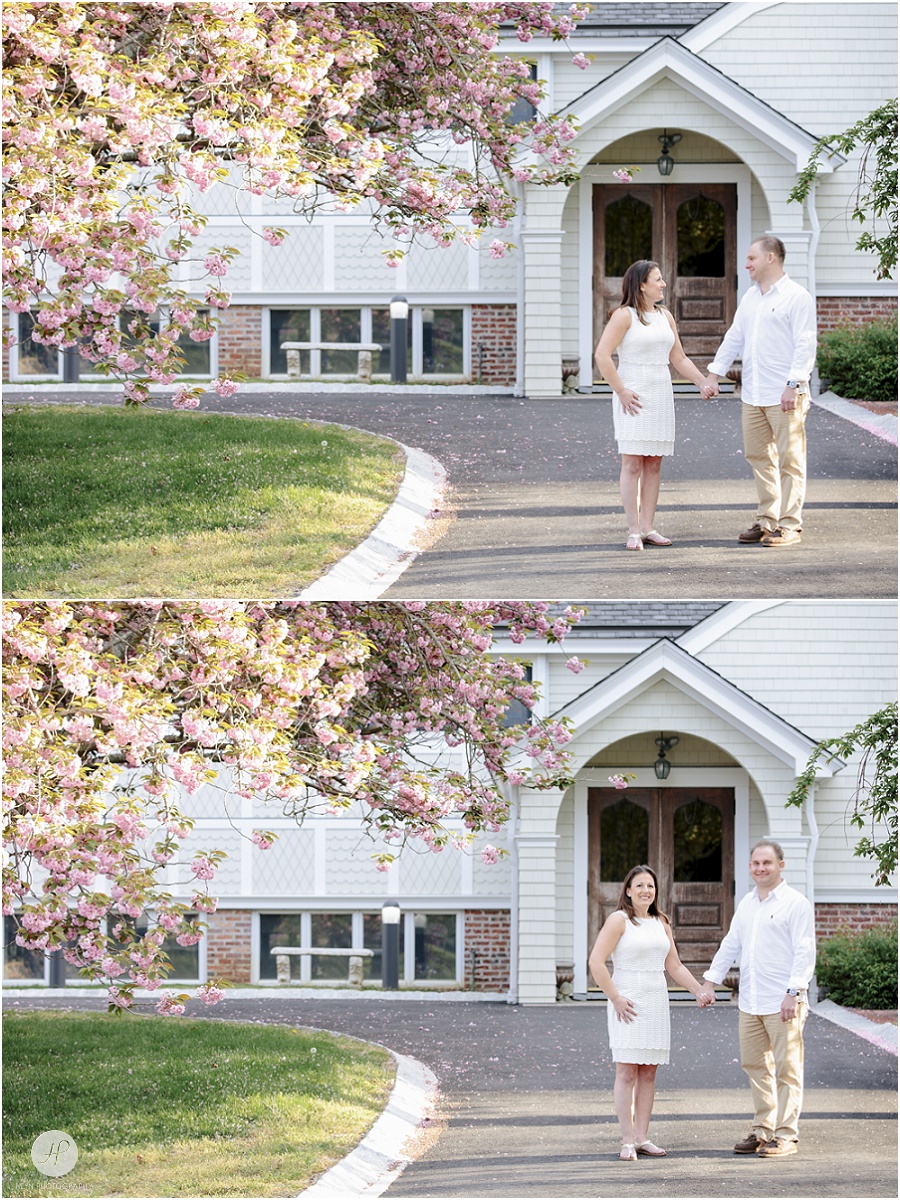 Couple in driveway in Spring Lake engagement session