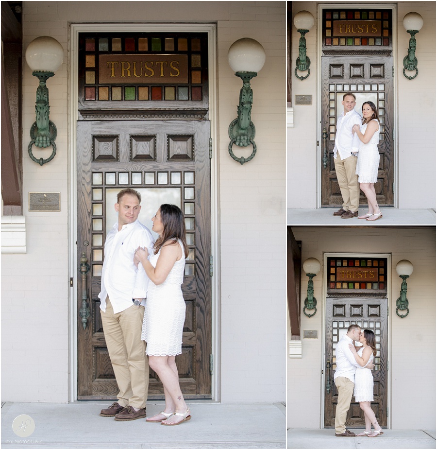 Couple by train station in Spring Lake engagement session