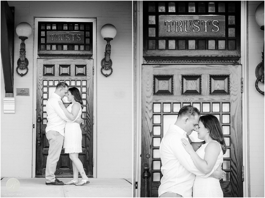 black and white of Couple by train station in Spring Lake engagement session