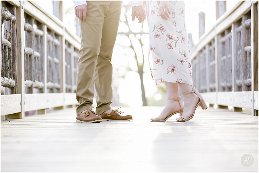 couples shoes on bridge at spring lake engagement session in new jersey 