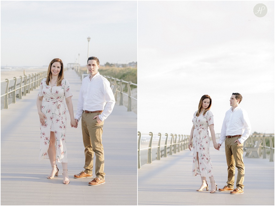 couple on boardwalk at beach at spring lake engagement session in new jersey 