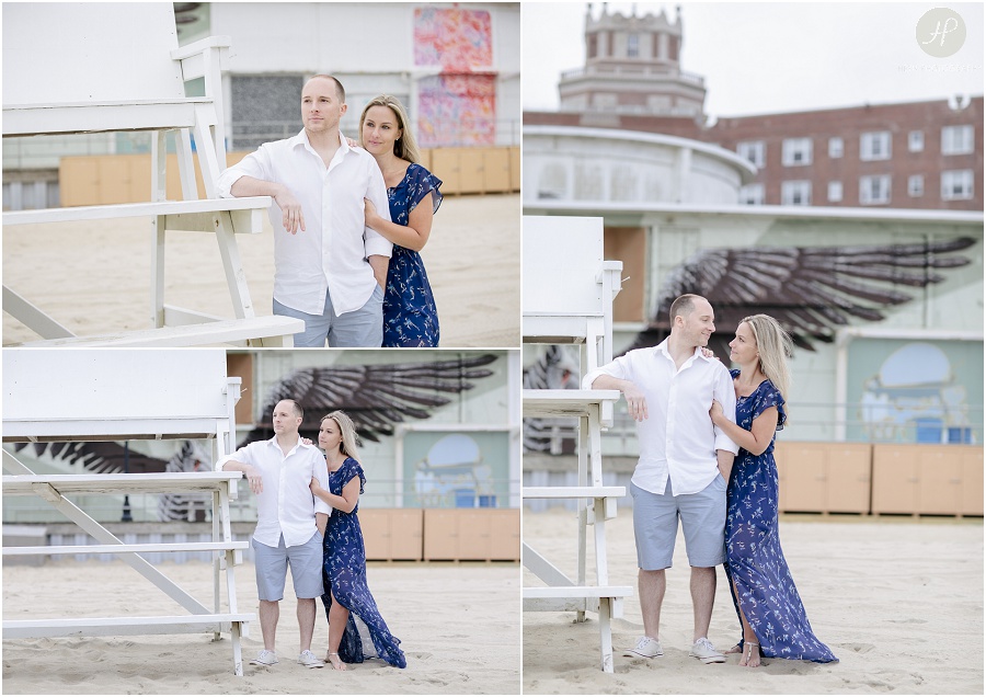 couple standing by lifeguard stand in Asbury Park engagement session jersey shore 