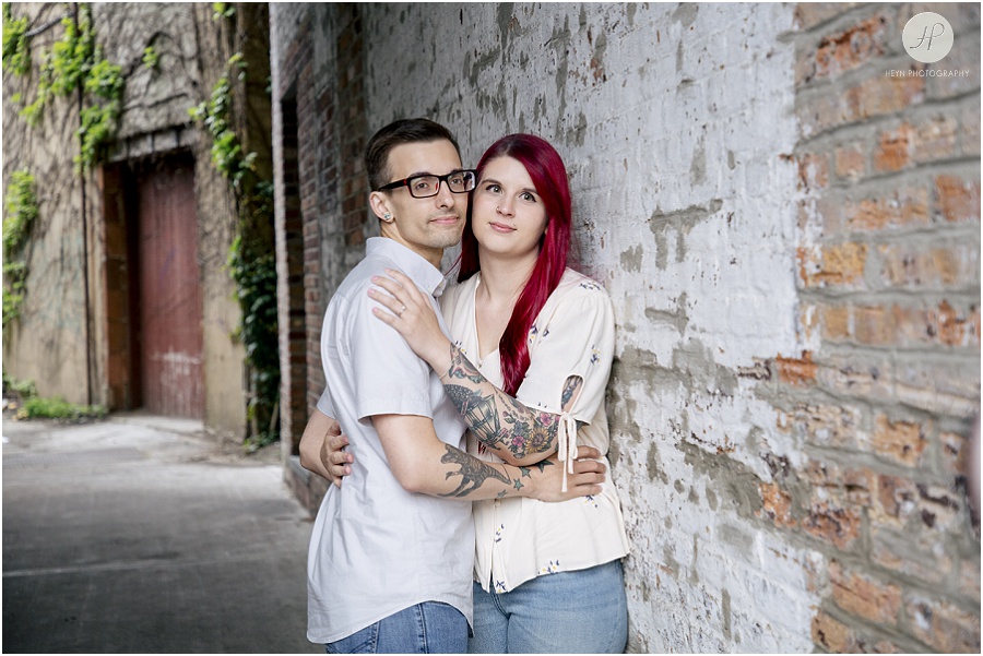 engaged couple in alley at downtown asbury park engagement session 