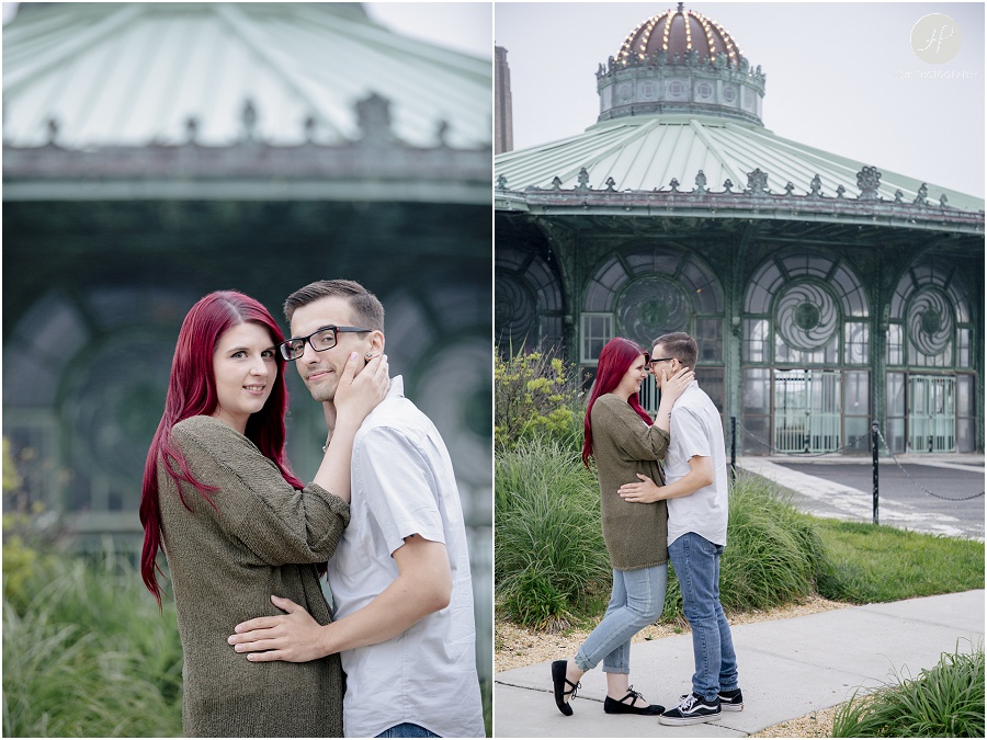 engaged couple kissing in front of carousel at downtown asbury park engagement session 