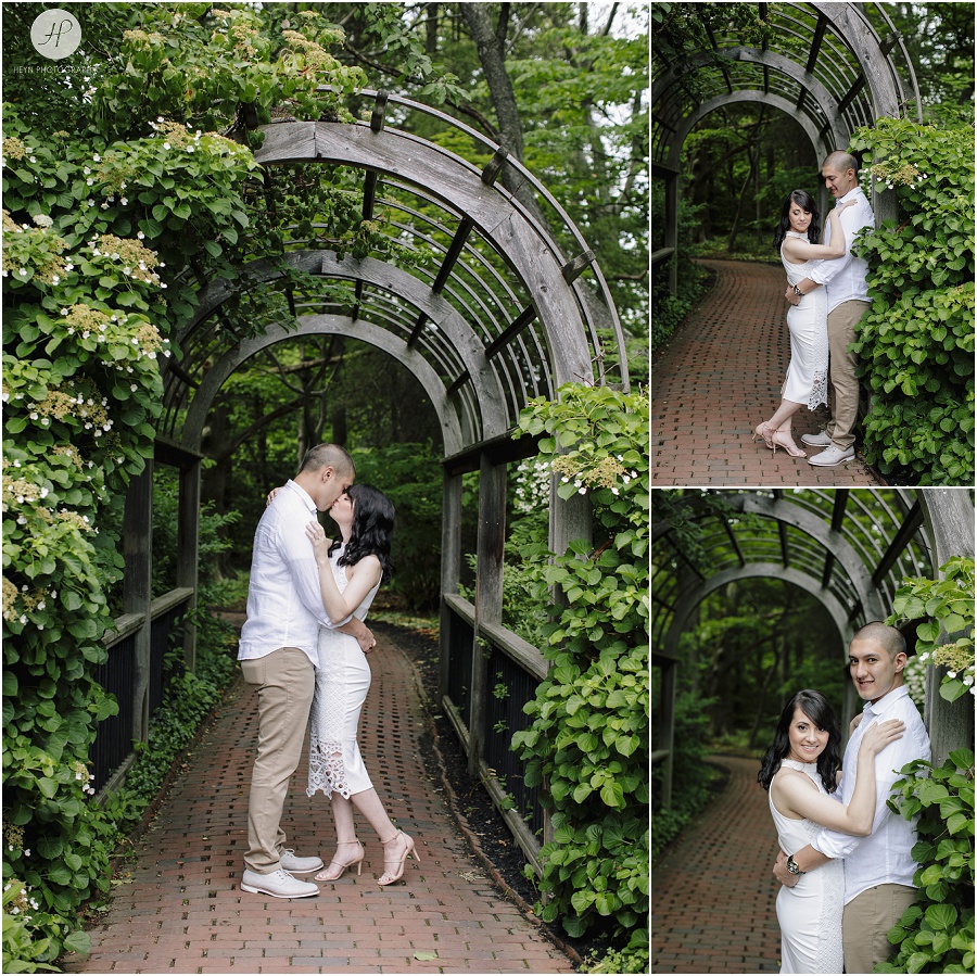 engaged couple under arch at sayen gardens new jersey shoot 