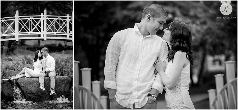black and white of engaged couple on rocks at sayen gardens new jersey shoot 