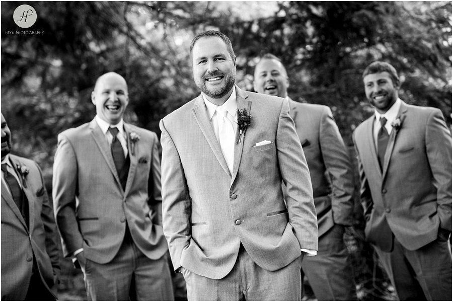 black and white of groom and his groomsmen at  clarks landing wedding 