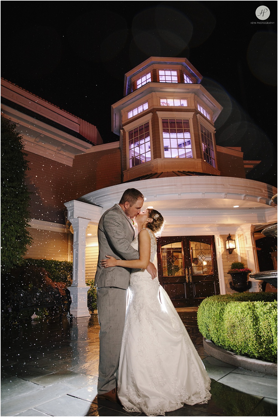  bride and groom outside at clarks landing yacht club  in the rain wedding 