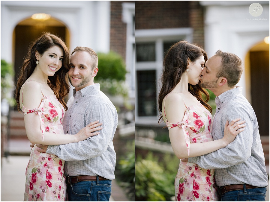  engaged couple kissing in front of brick building in downtown spring lake engagement session