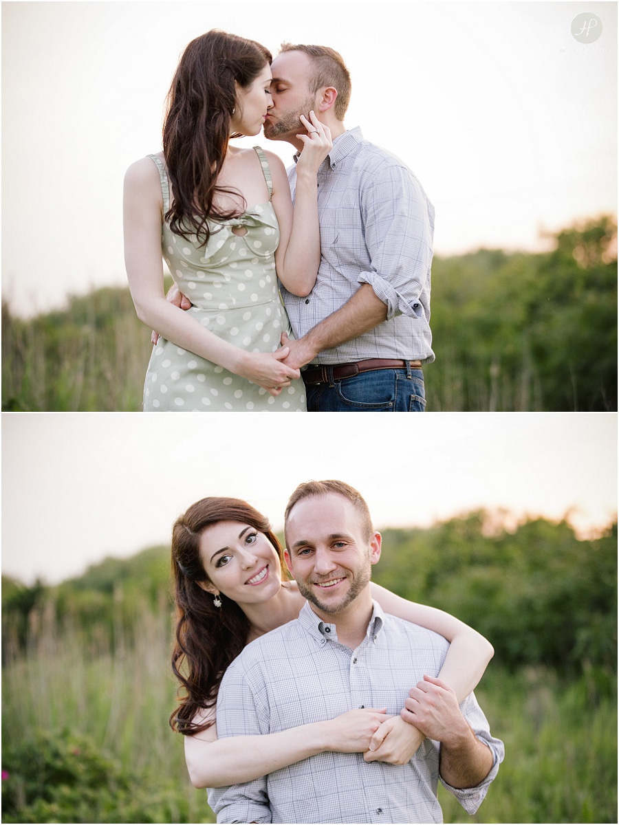  engaged couple kissing tall grass at dusk in downtown spring lake engagement session