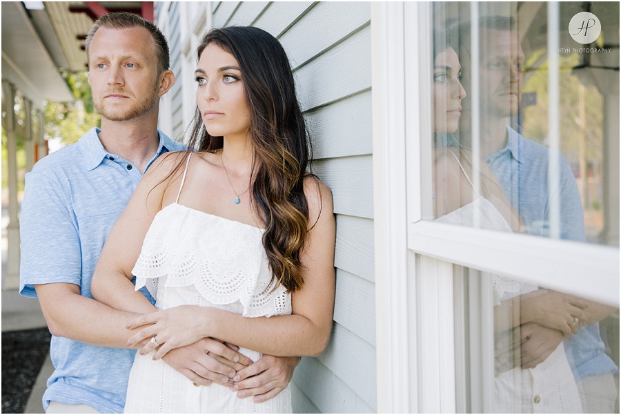 engaged couple at train station in manasquan beach engagement shoot