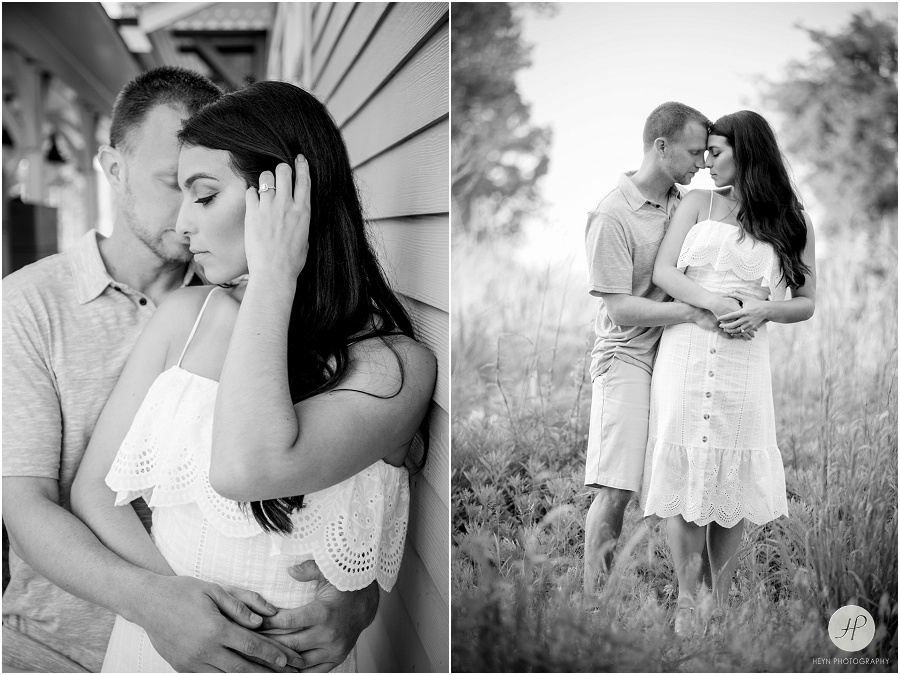 black and white of engaged couple at train station in manasquan beach engagement shoot