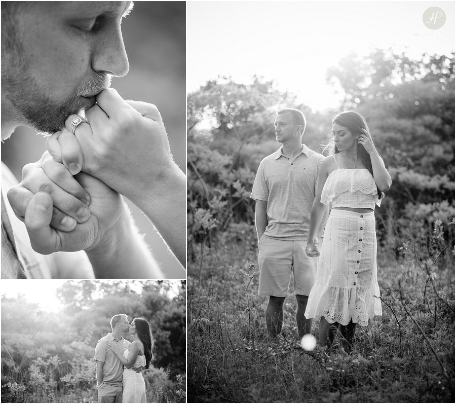 black and white of engaged couple in field during sunset in manasquan beach engagement shoot