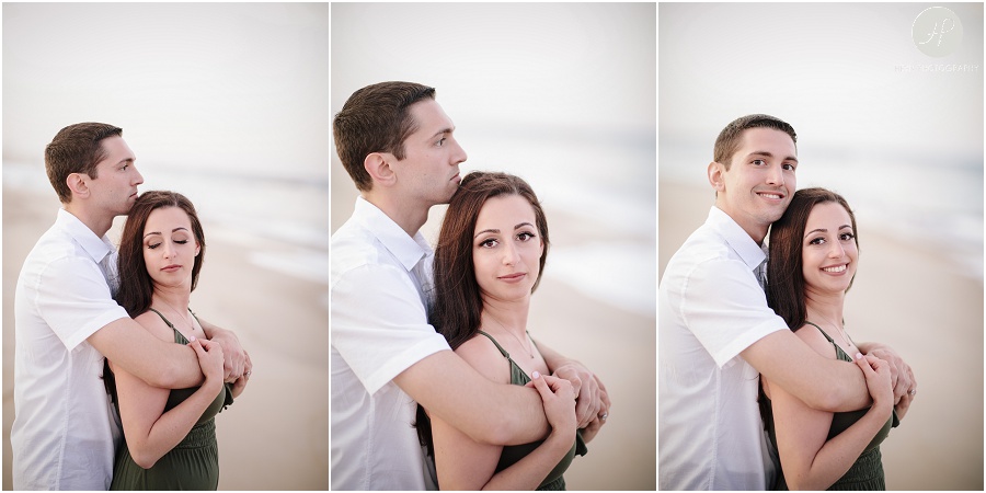 engaged couple on beach in spring lake engagement session