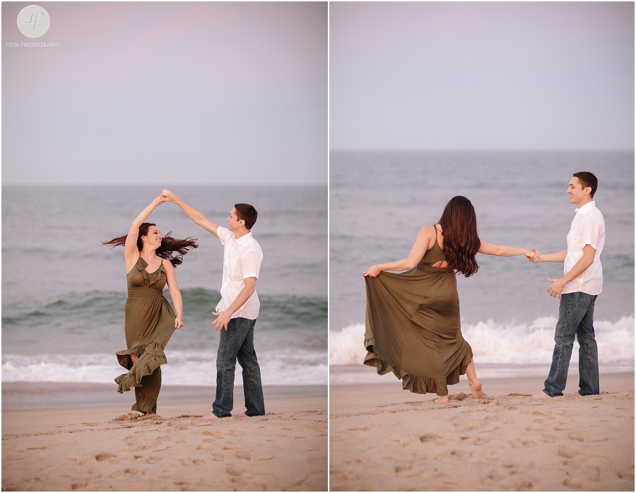 engaged couple dancing on beach in spring lake engagement session