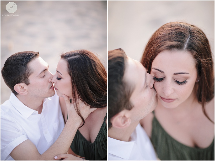 engaged couple sitting on beach in spring lake engagement session