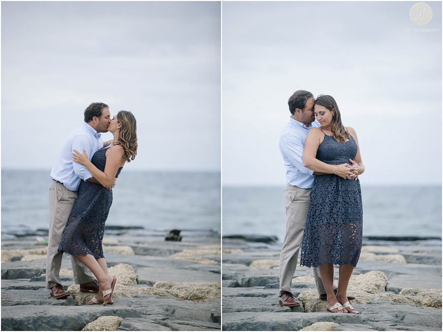 couple on beach on jetty at asbury park engagement session 