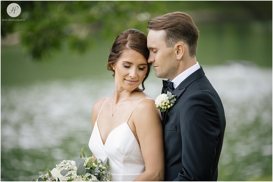 bride and groom in spring lake park at clarks landing yacht club wedding 