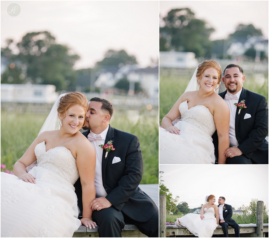 bride and groom sitting on dock at clarks landing yacht club