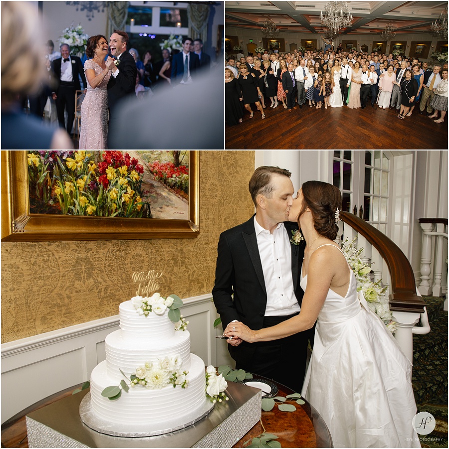 bride and groom cutting cake in ballroom at clarks landing yacht club wedding reception 