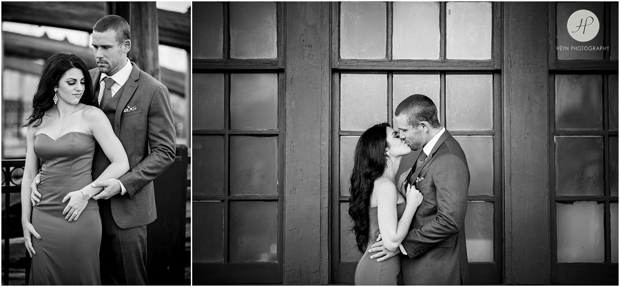 black and white of couple by old bridge in liberty state park engagement session jersey city