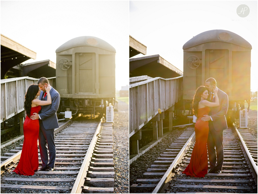 couple by old train tracks in liberty state park engagement session jersey city