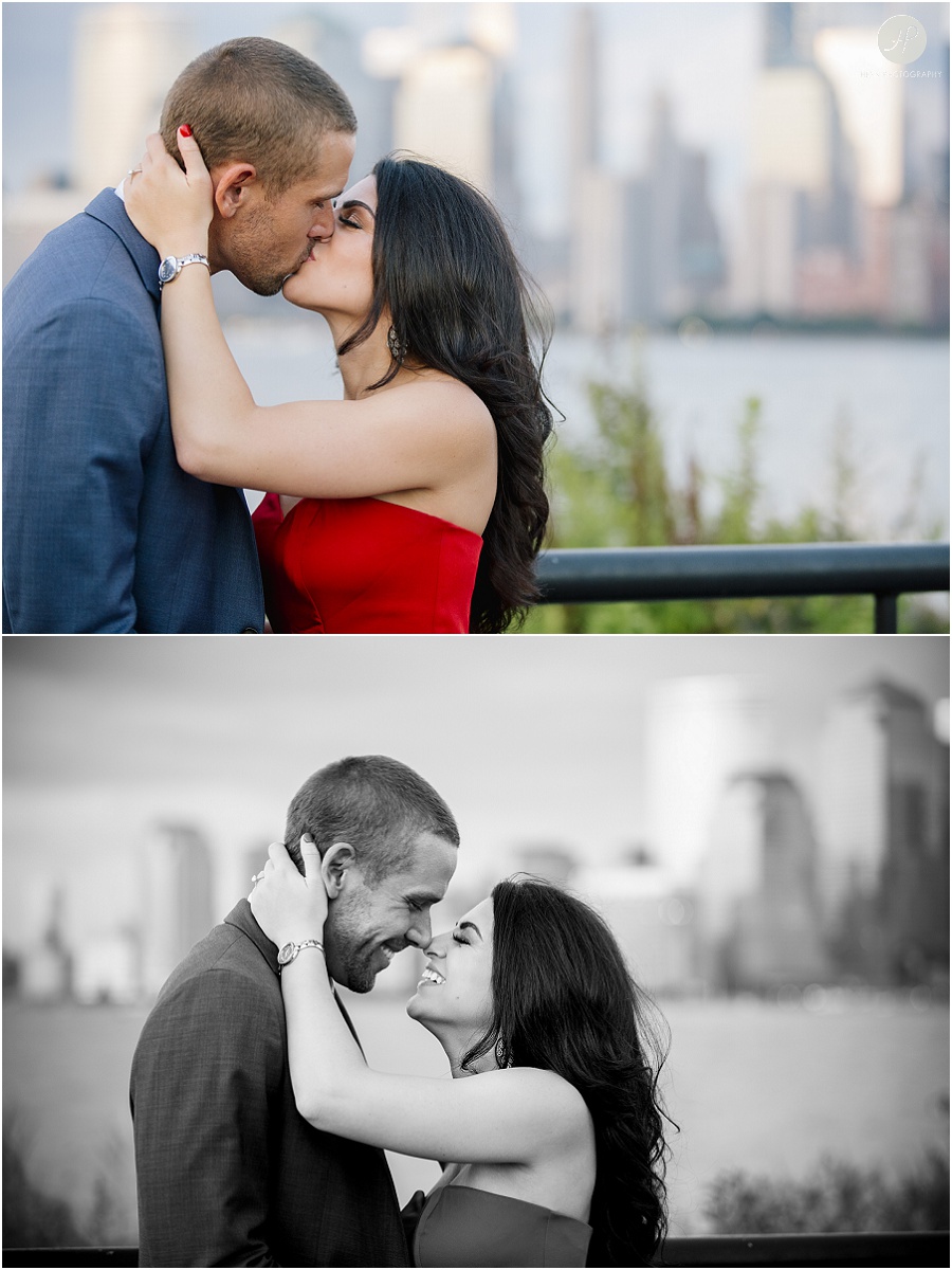 couple kissing by nyc skyline in liberty state park engagement session jersey city