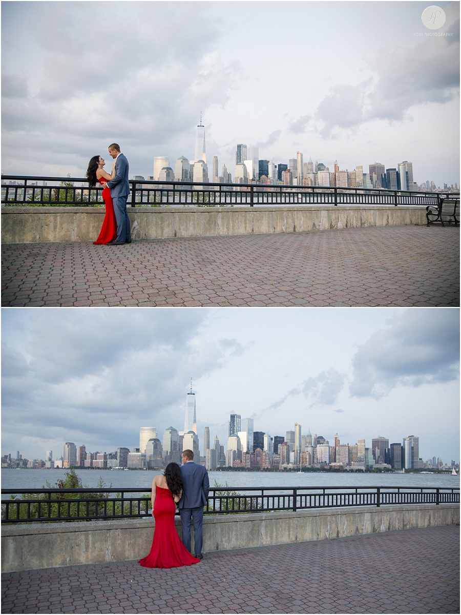 couple by nyc skyline in liberty state park engagement session jersey city