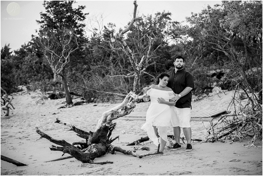 black and white of couple on beach at sandy hook engagement session