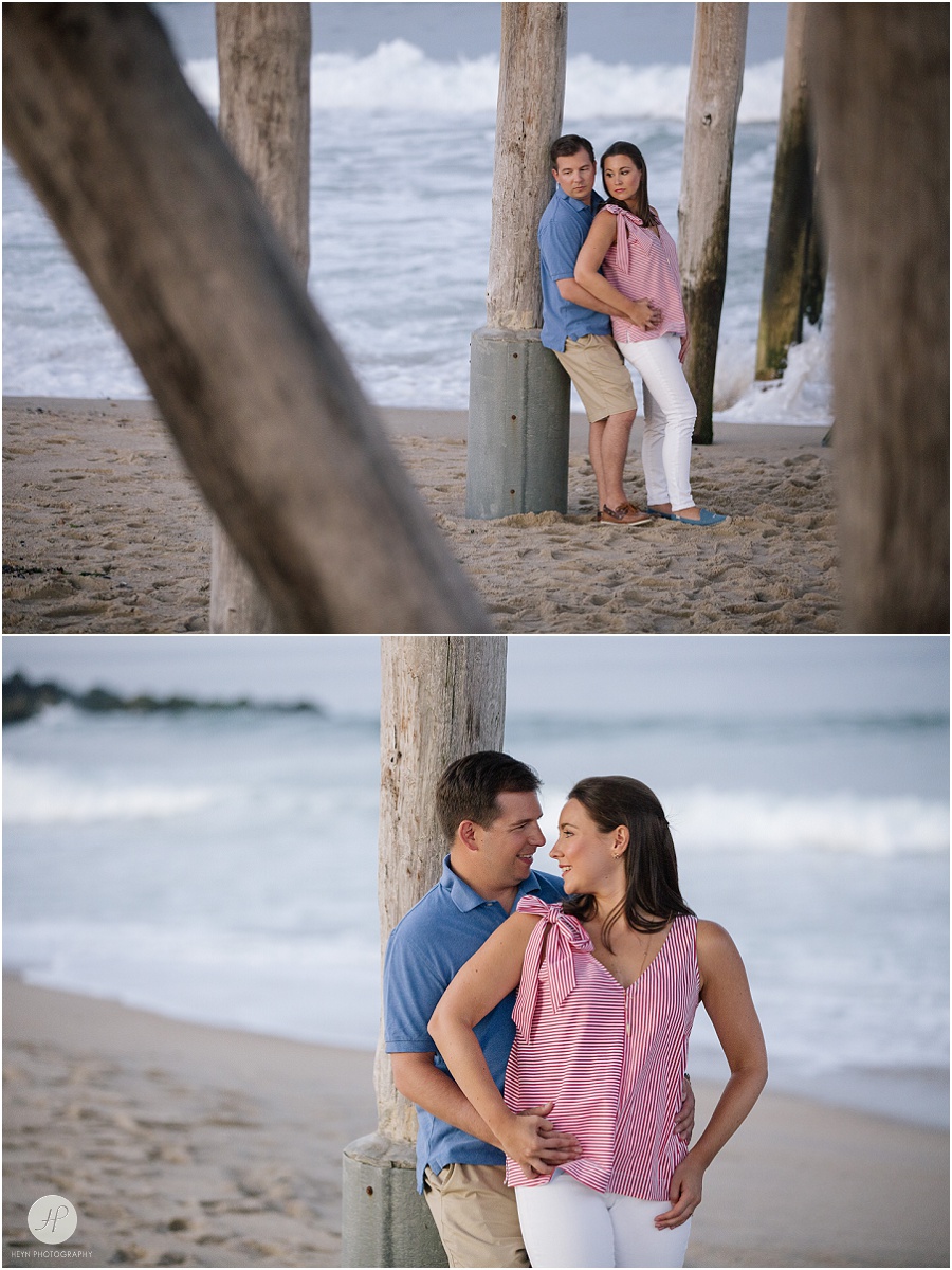 couple under pier in belmar beach at spring lake engagement session