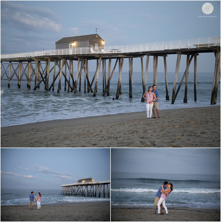 couple at night by pier in belmar beach at spring lake engagement session