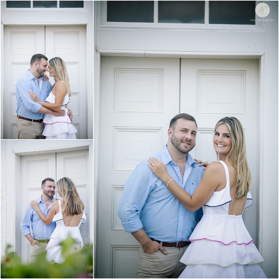 engaged couple by lighthouse on long beach island engagement session