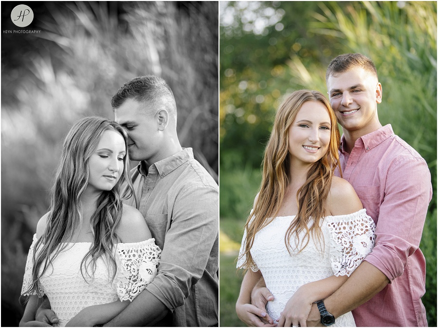 engaged couple in tropical grass on manasquan beach engagement 