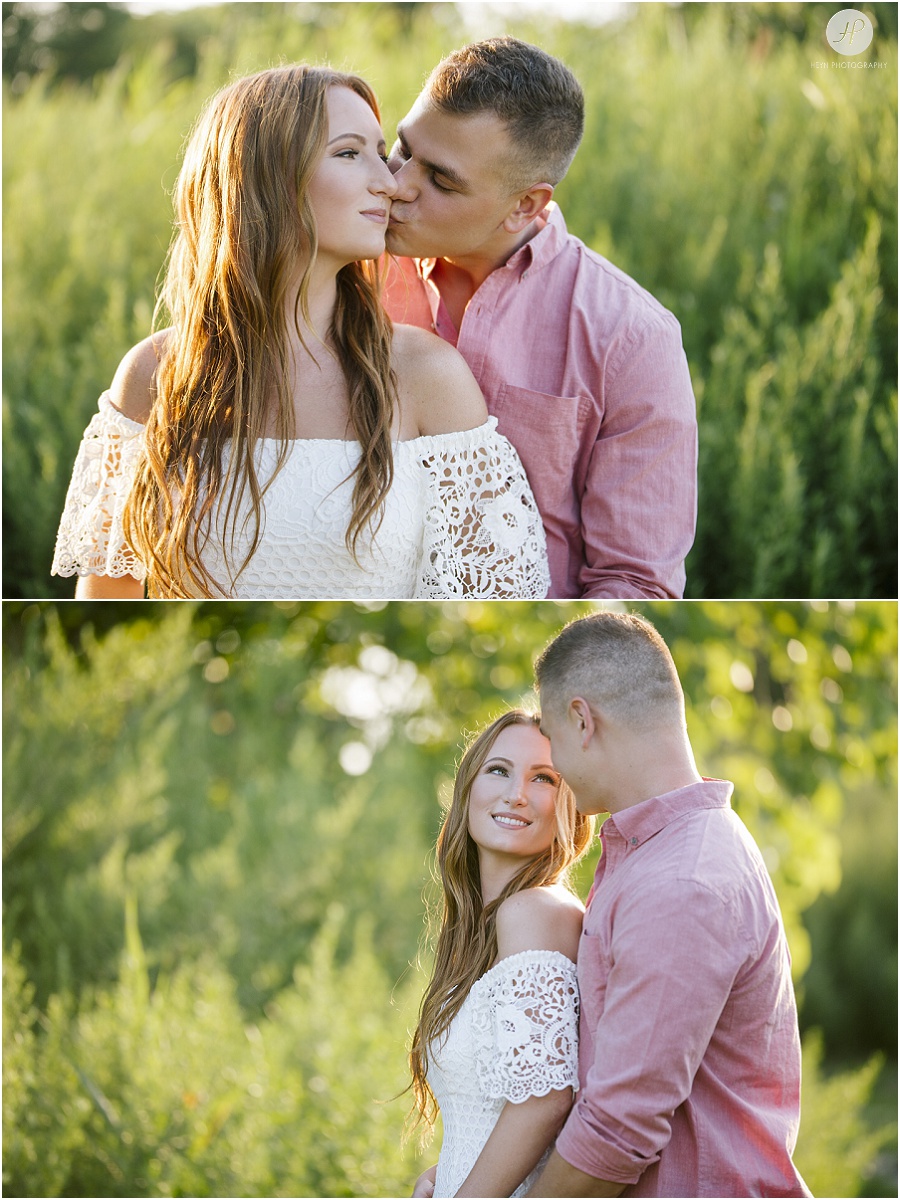 engaged couple in tropical grass on manasquan beach engagement 