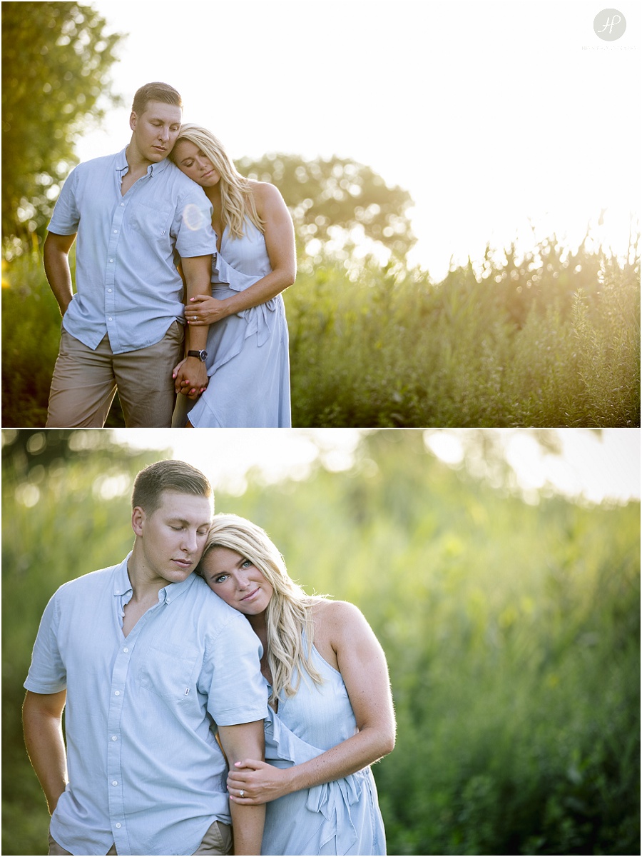 couple in grass near beach at manasquan engagement session at sunset