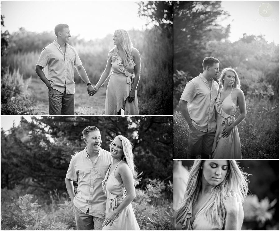 black and white of couple in grass near beach at manasquan engagement session at sunset