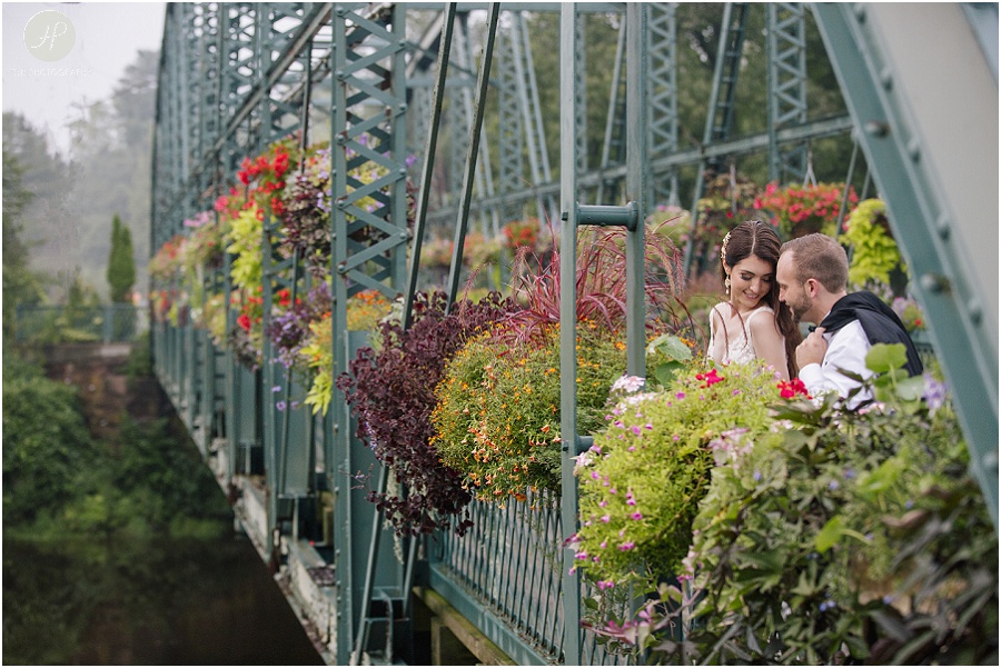 bride and groom portraits on the flower bridge at wedding at the riverview 