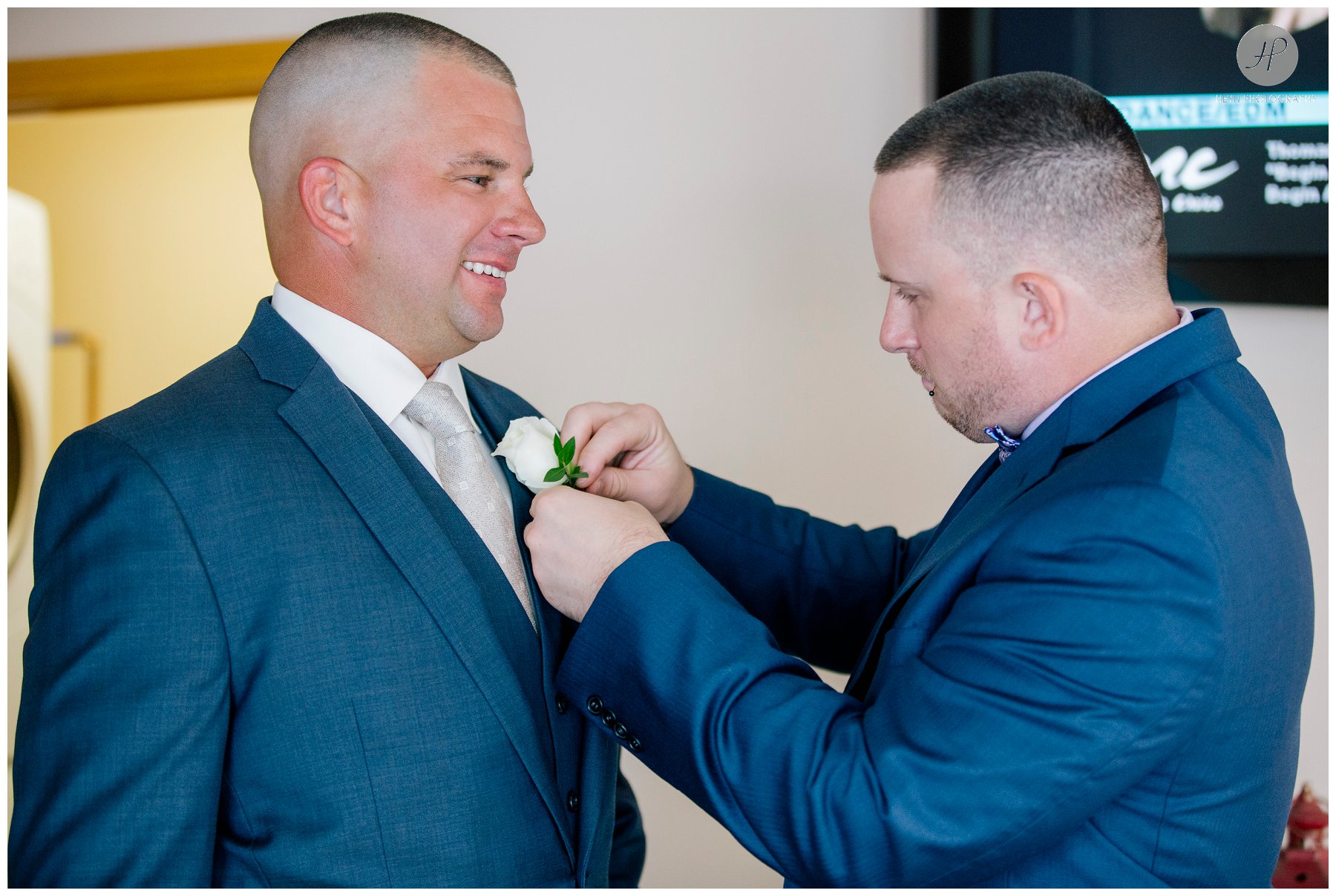 best man pinning on boutonniere on groom before salt creek grille wedding in new jersey 