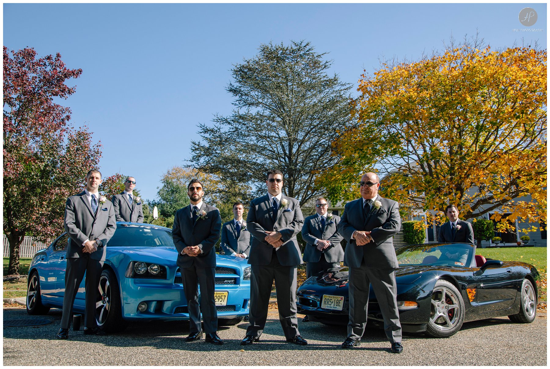 groom with groomsmen and cars before south gate manor wedding in new jersey