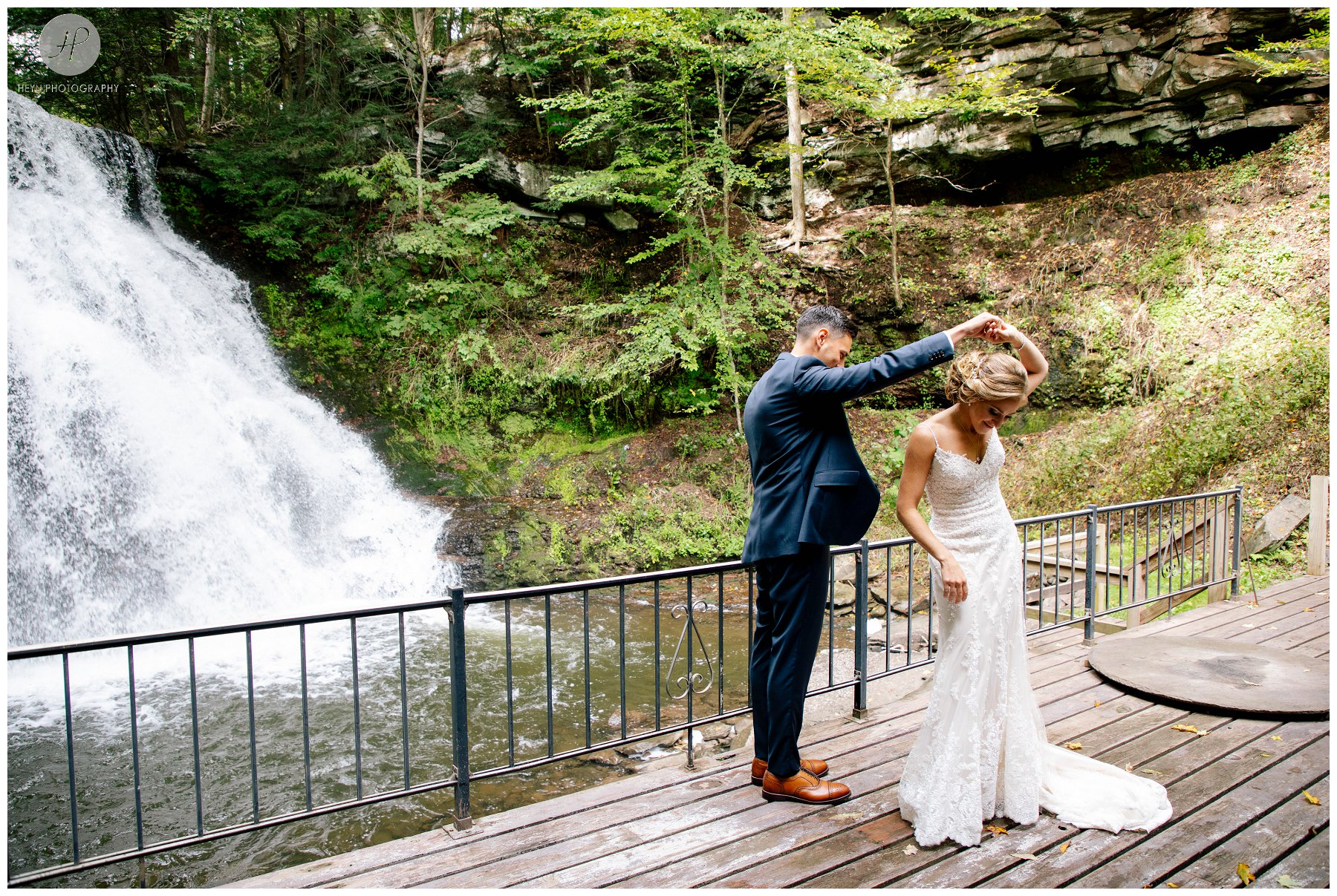bride and groom dancing by waterfall at stone tavern farm wedding in the catskills new york