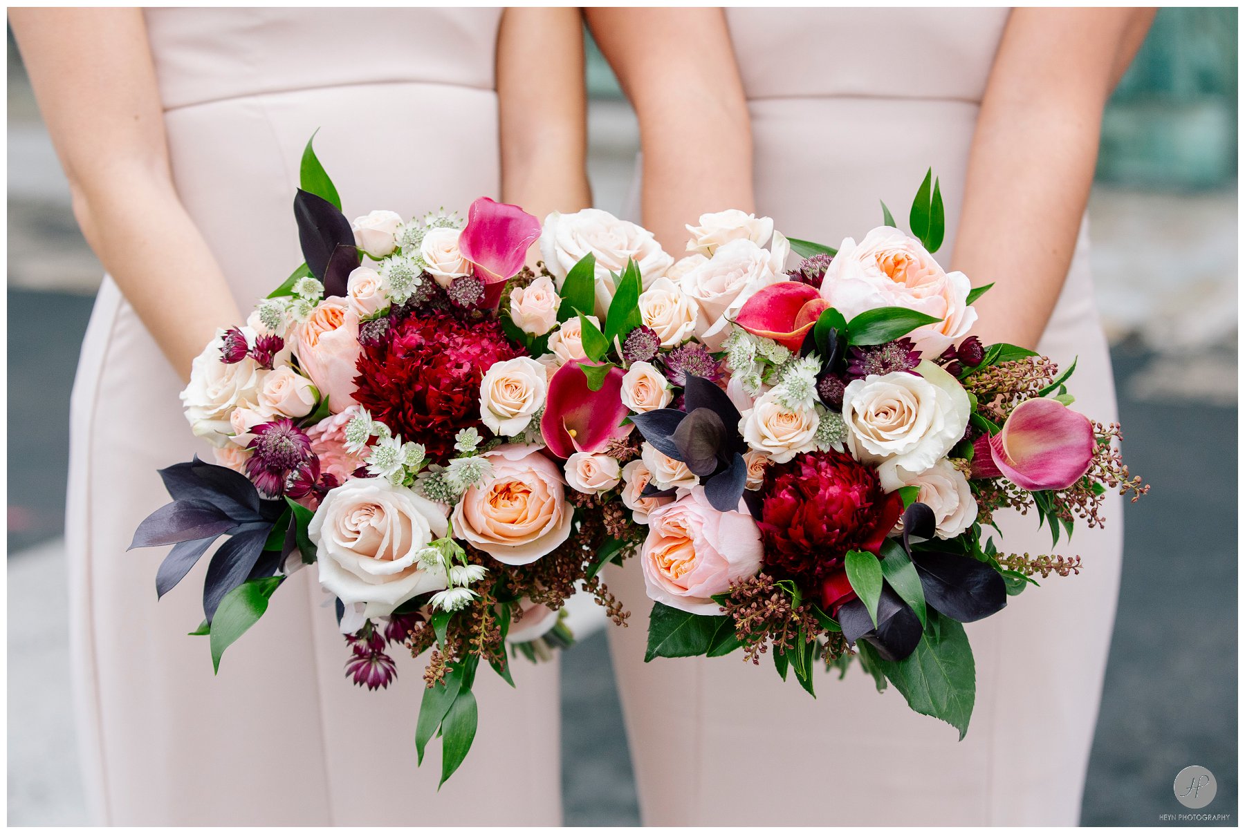 bridesmaids holding winter bouquets for  clarks landing yacht club wedding details