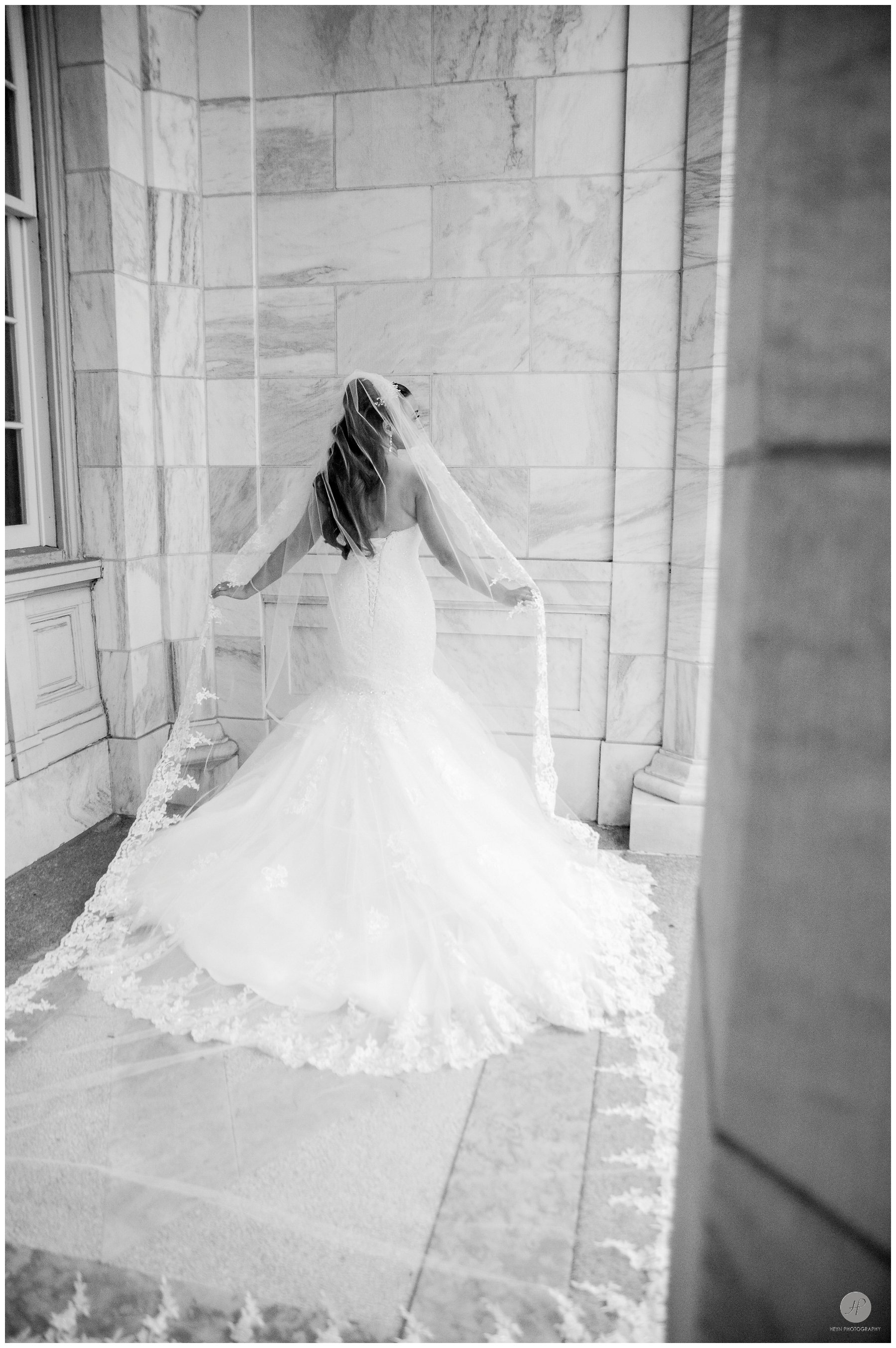 black and white photo of bride in asbury park before clarks landing yacht club wedding